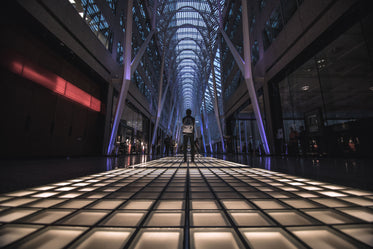 man stands on lit floor