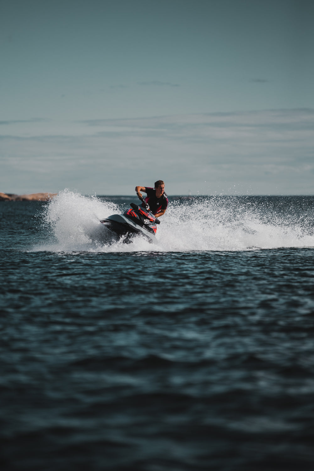 man takes sharp turn on jet ski