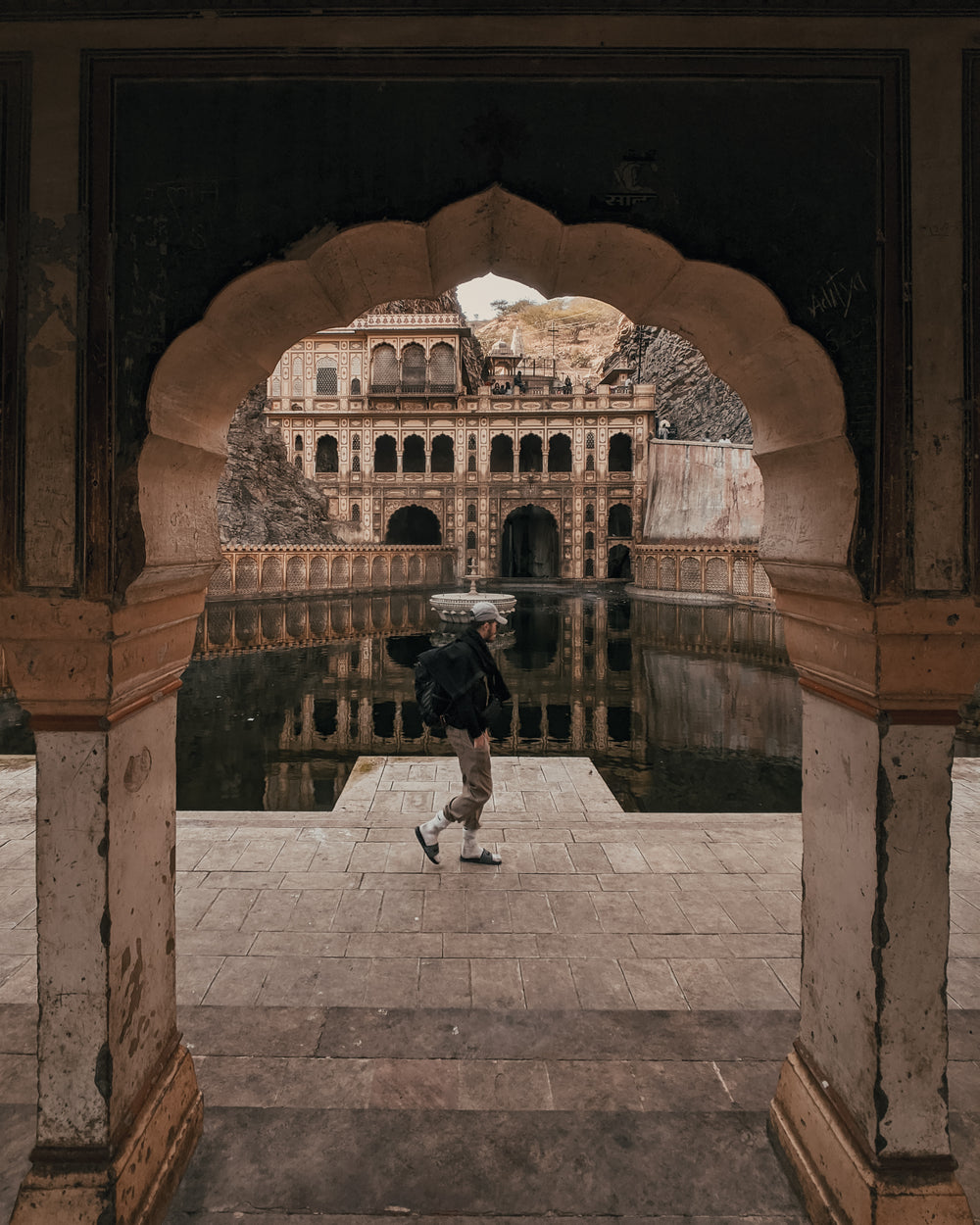 man walks around galta ji temple