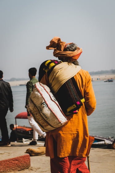 man walks towards boat