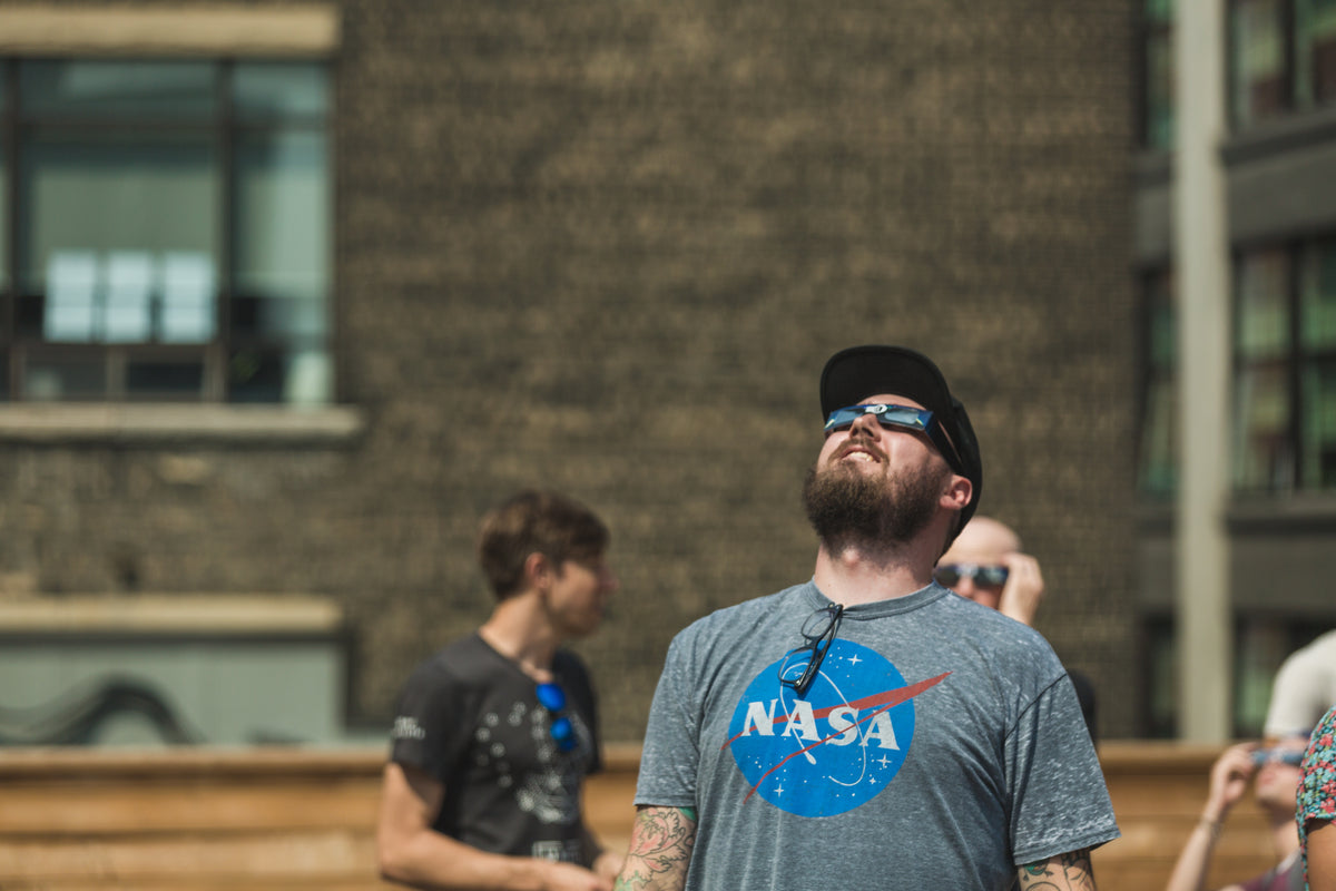man watches eclipse