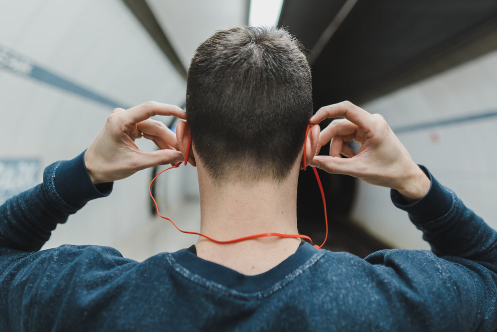 man wearing bluetooth earbuds