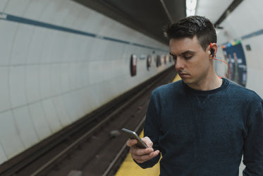 man wearing bluetooth headphones