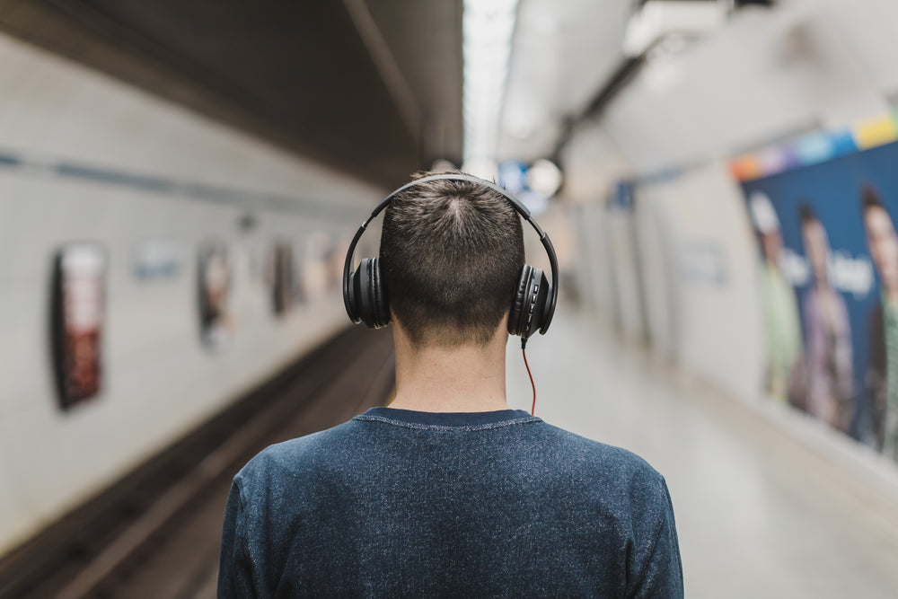 man wearing over ear headphones