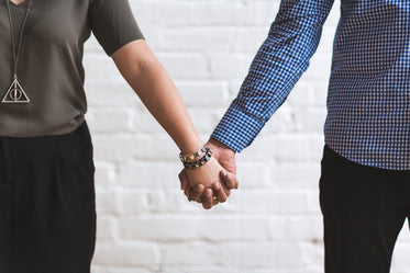 man & woman holding hands