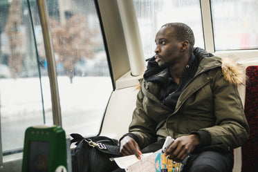 man looking out window on ttc