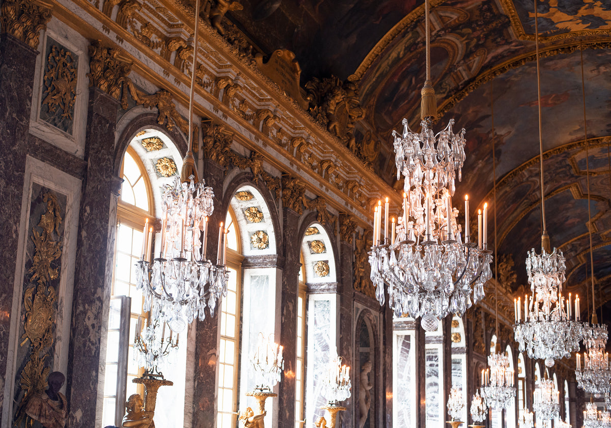 many chandeliers hang from the ceiling