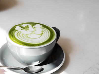 Matcha Latte In A Grey Mug On A White Table
