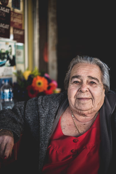 mature woman sitting outside of restaurant