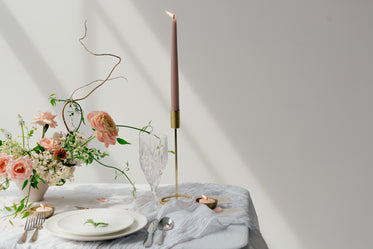 mauve candle on white table