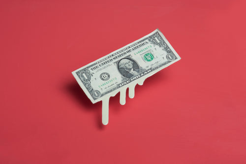 melting dollar bill money drips