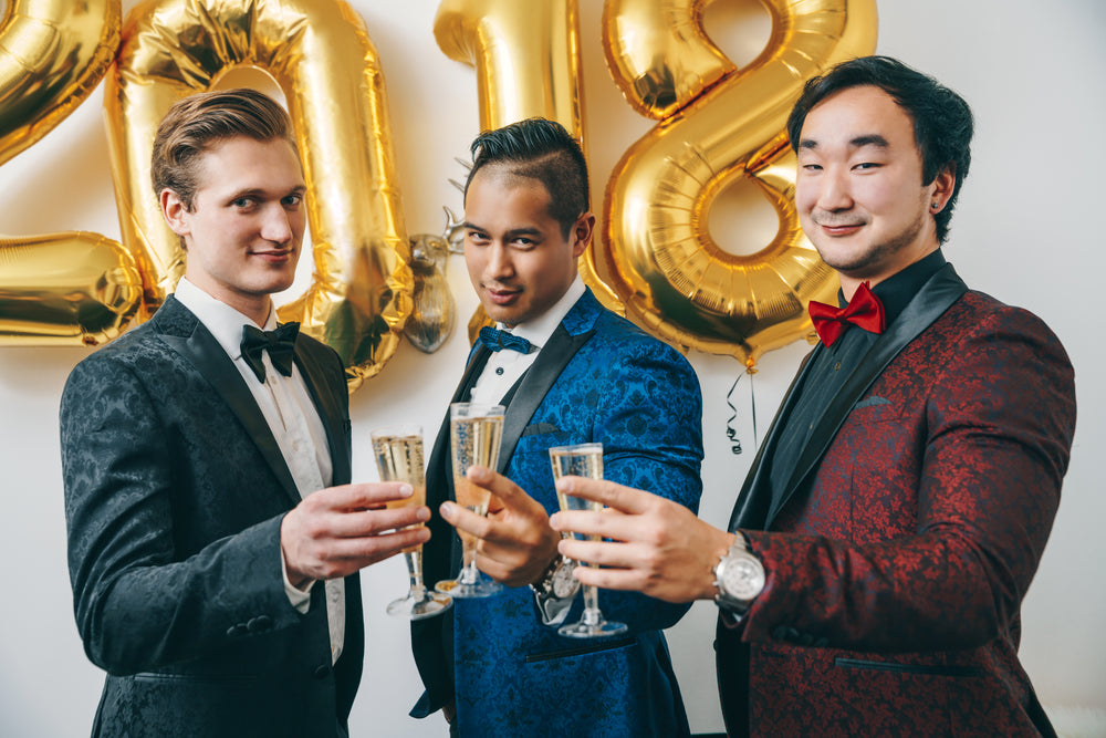 men in tuxedos cheers nye