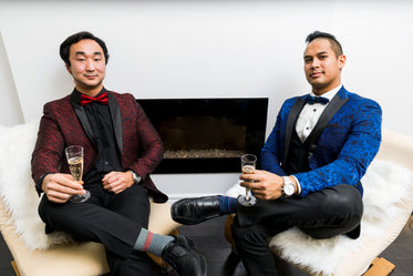 men in tuxedos with champagne