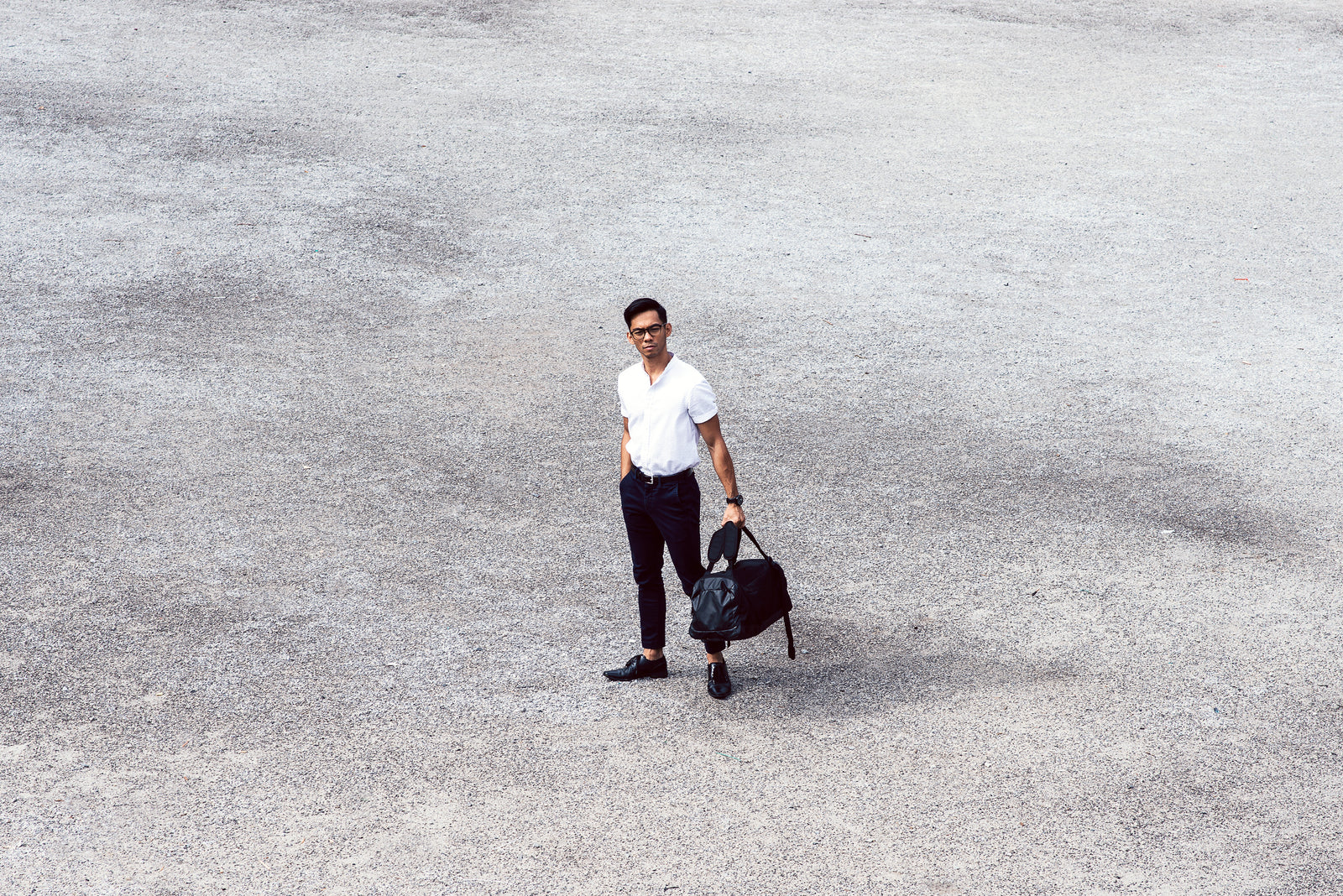 Men's luggage and travel accessories arranged for a trip