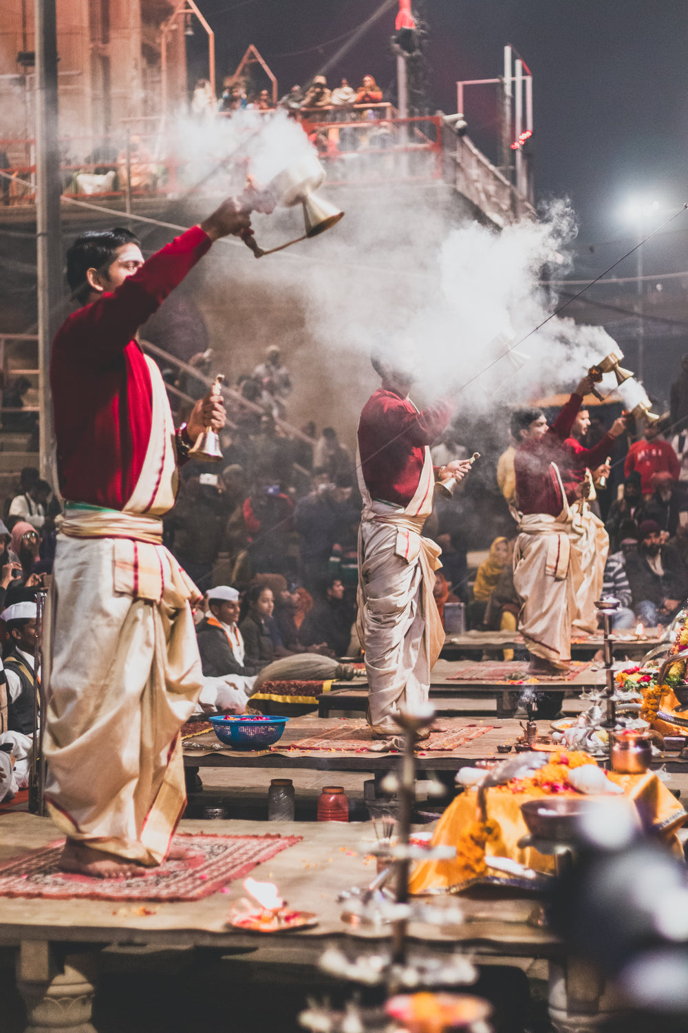 men stand on tables during ceremony