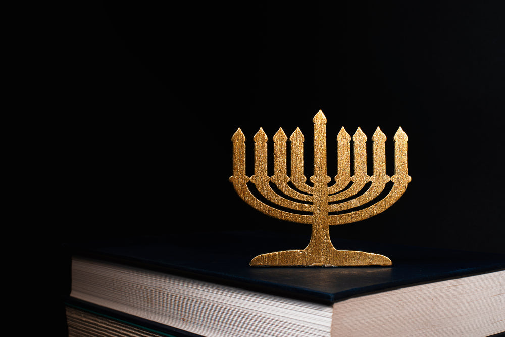 menorah stands on hebrew bible