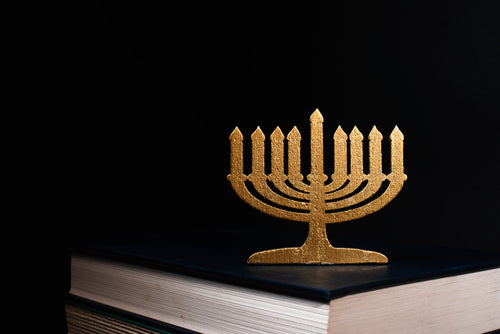 menorah stands on hebrew bible