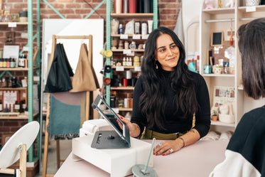 merchant showing customer pos ipad
