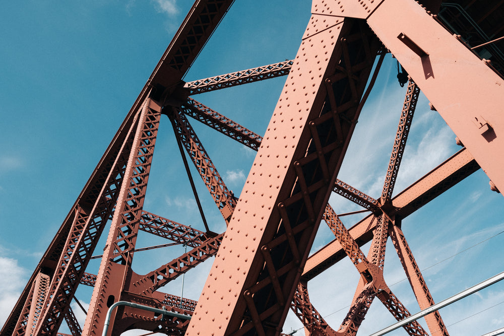 metal bridge beams with blue sky