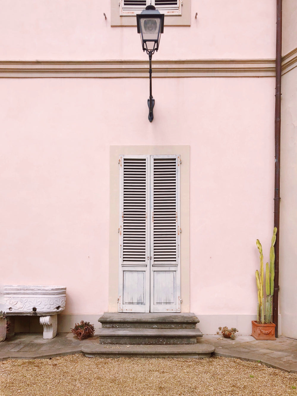 metal lamp over wooden door