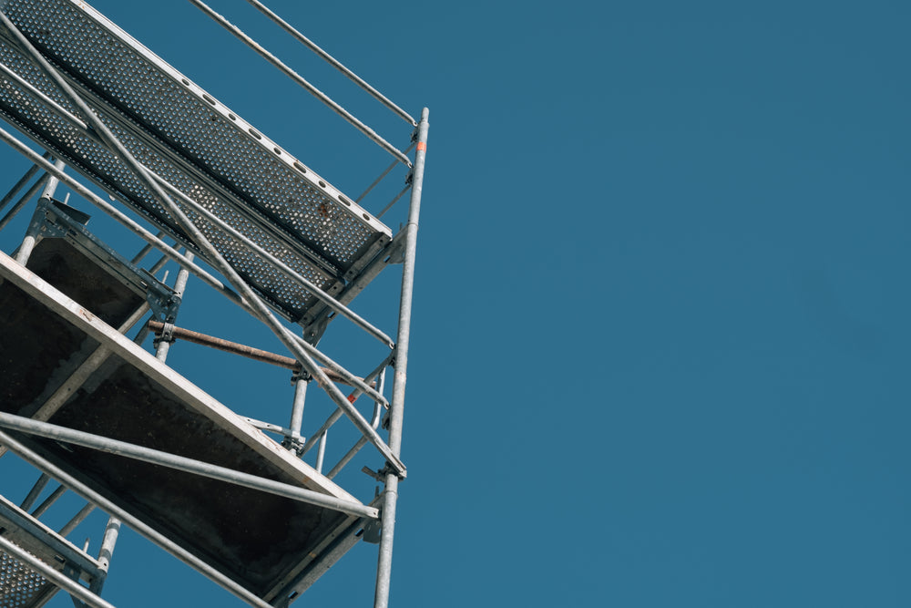 metal scaffolding and clear blue skies