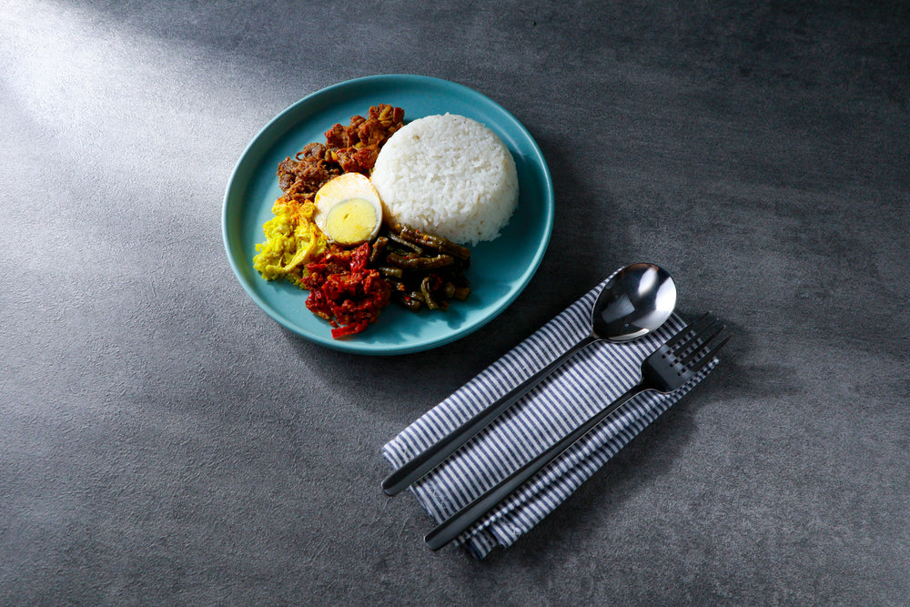 minimal blue plate of food and a place setting