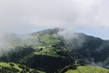 mist rolls through foreground of landscape