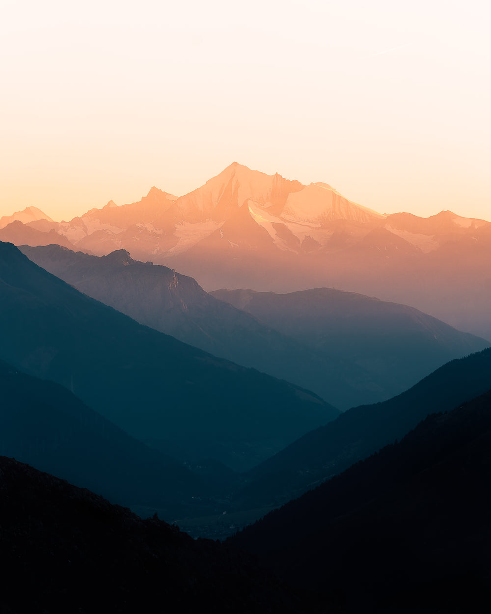 misty mountain ranges at sunrise