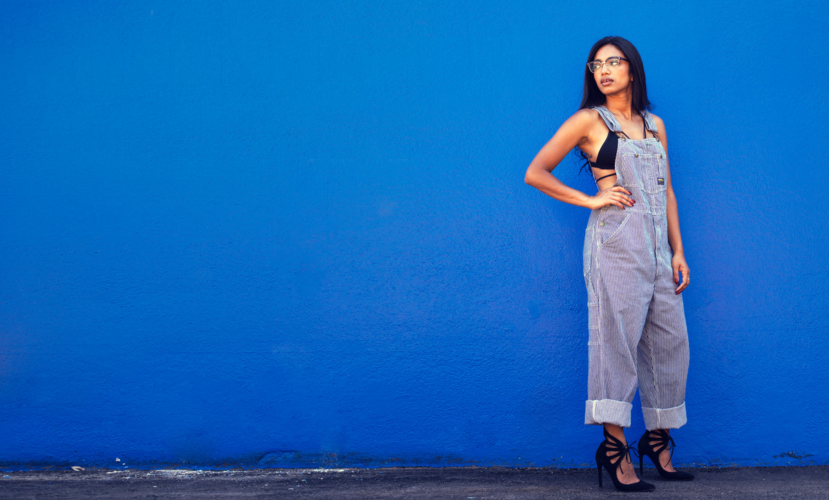 model in heels and overalls with blue