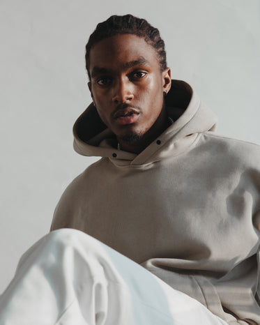 model in latte colored hoodie