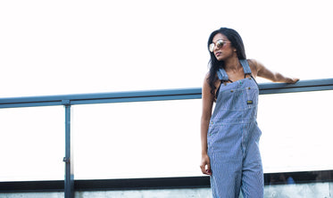 model in overalls on bright day
