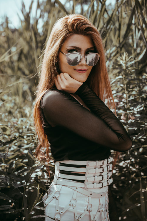 model looks over sunglasses