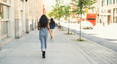 model walks in heels in the city