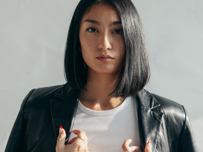 Model With Leather Jacket Over Shoulders