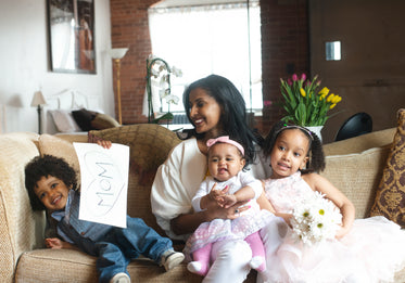 mom and children on sofa