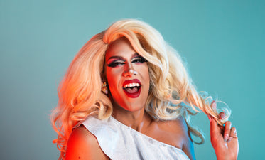 blonde drag performer laughing