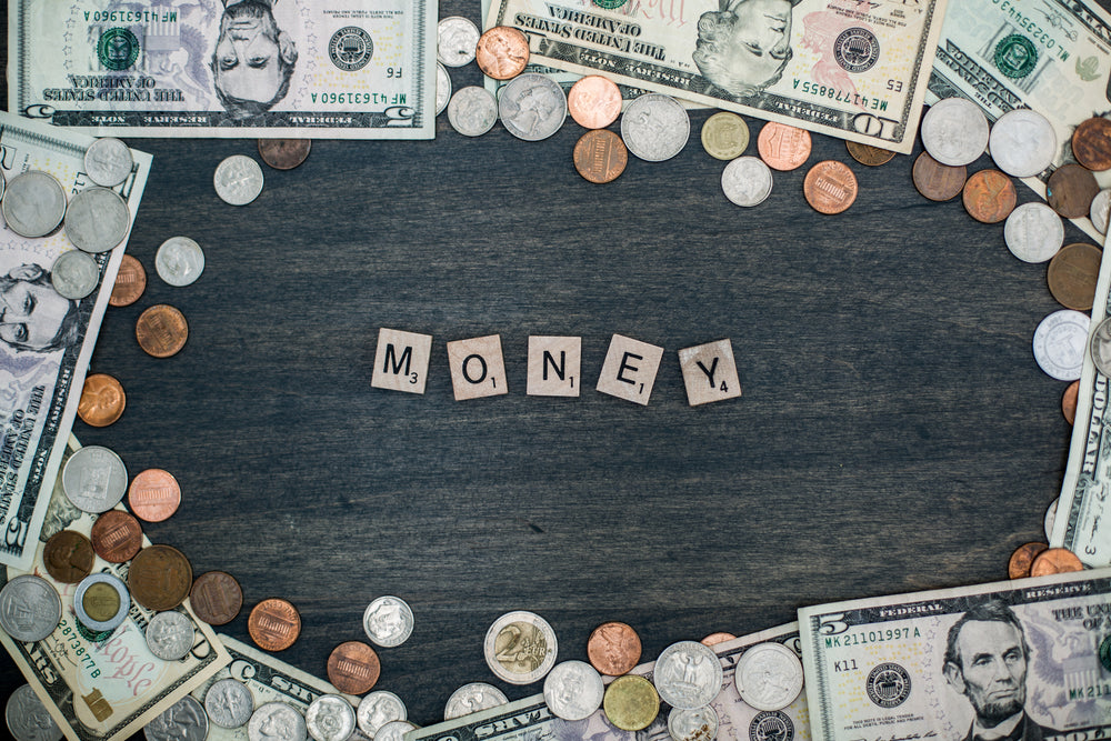 money letter tiles and coin