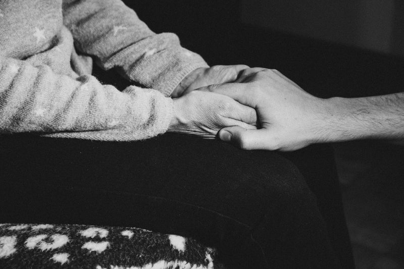 monochrome image of person holding someones elses hand - Image of automotive, A photo of a customer 