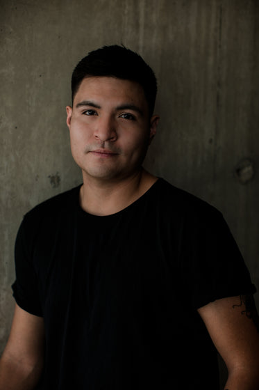 moody portrait of person wearing a black tee