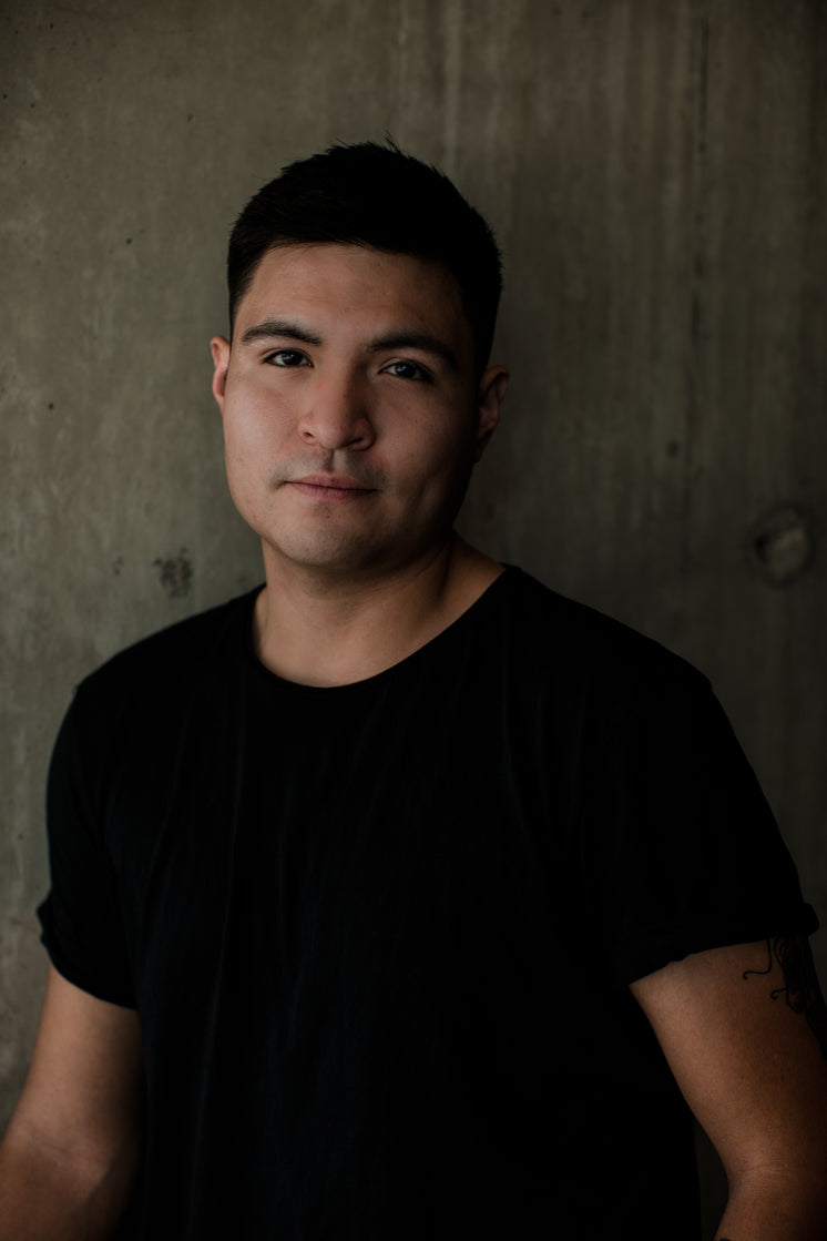 Moody Portrait Of Person Wearing A Black Tee