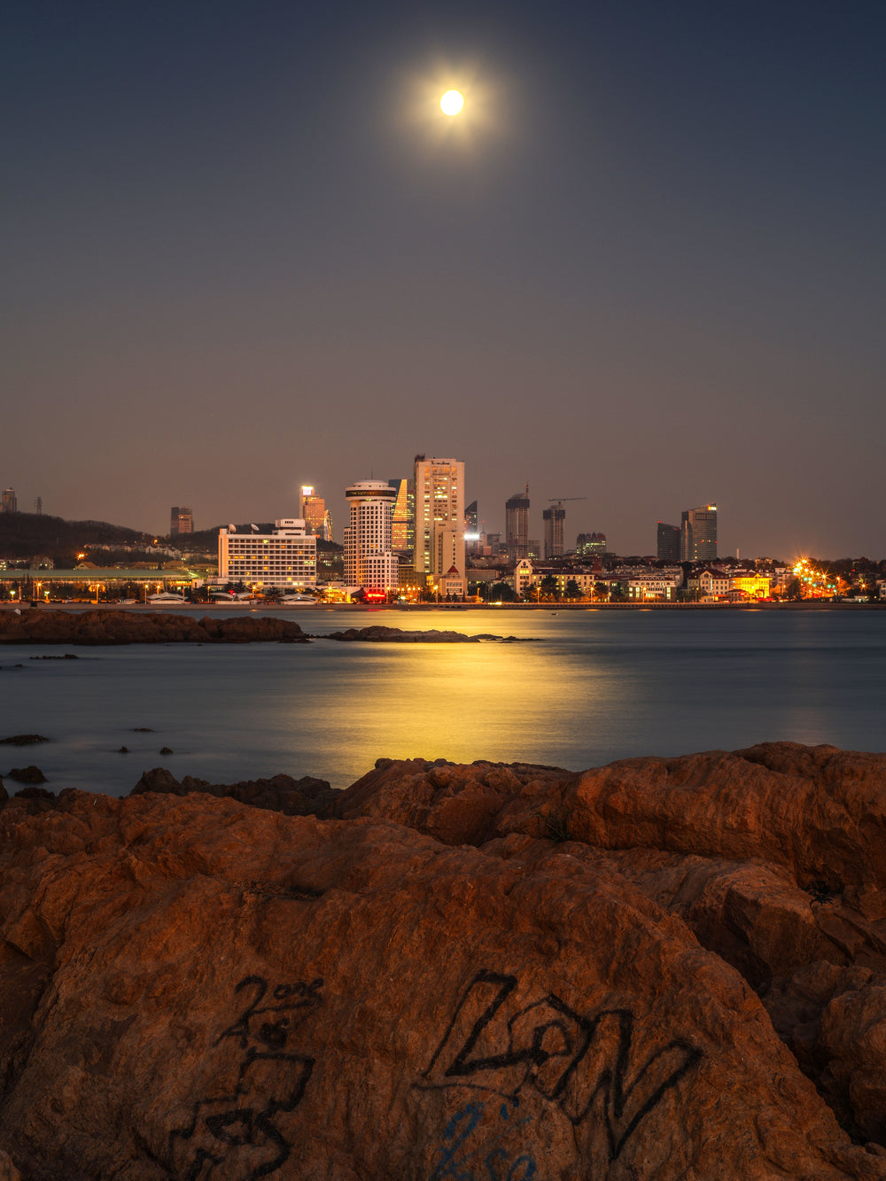 Moon Glistens Along The Water