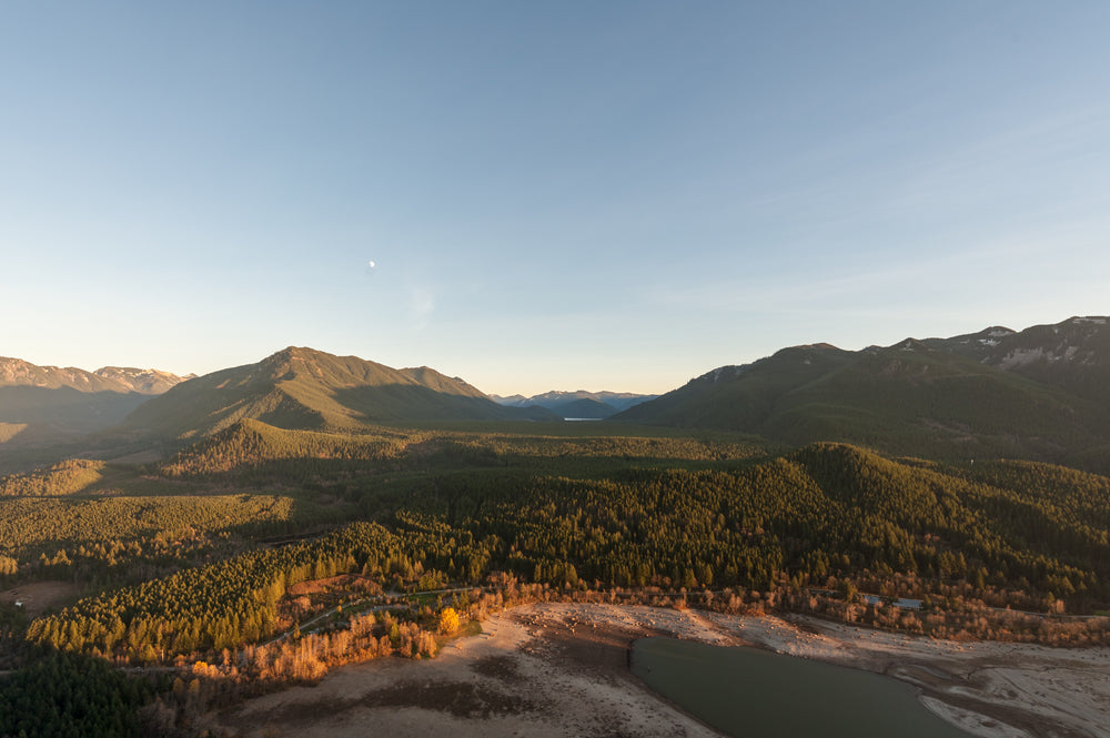 moon rises over mountains