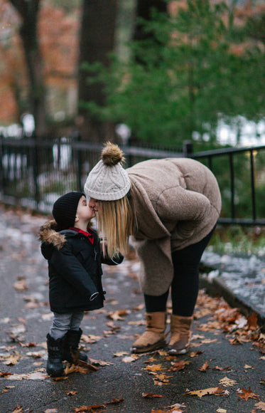 mother and son share a kiss