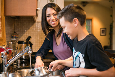 mother and son washing dishes