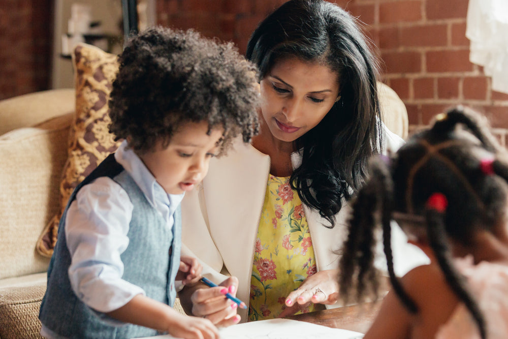 mother helping her son with drawing