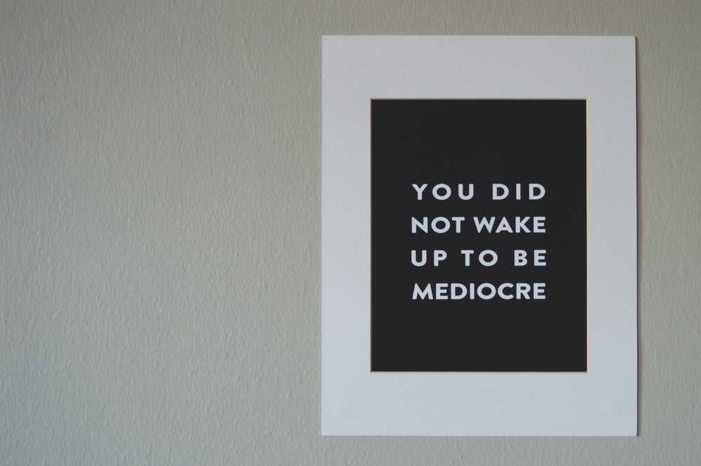 motivational screen printed poster on wall