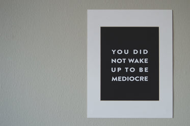 motivational screen printed poster on wall
