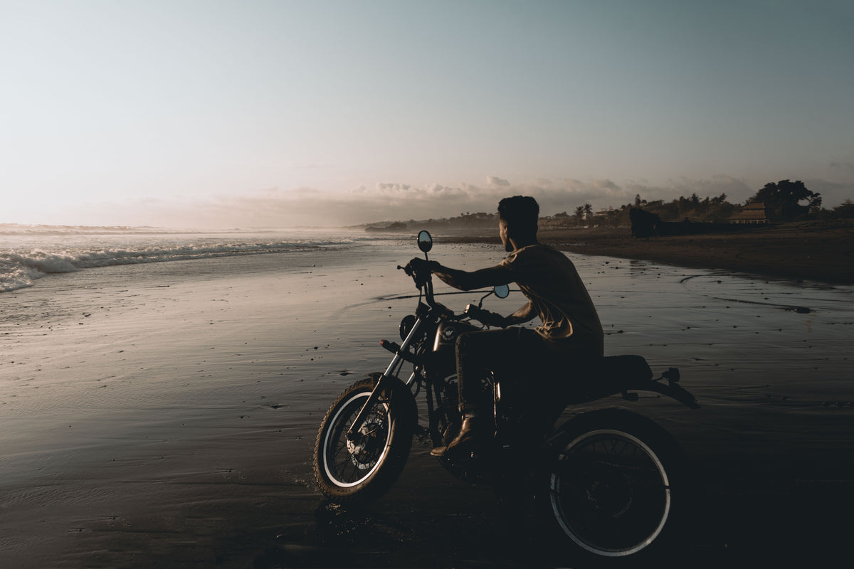 motorcycle on wet beach sands