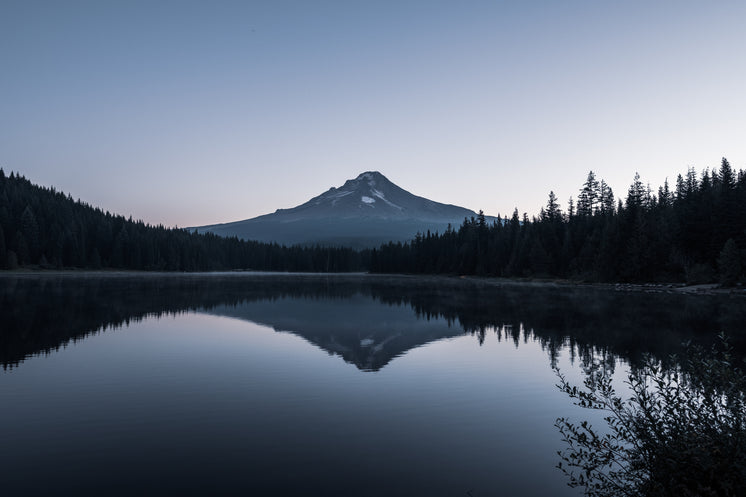 Mountain By Glassy Lake With Reflection