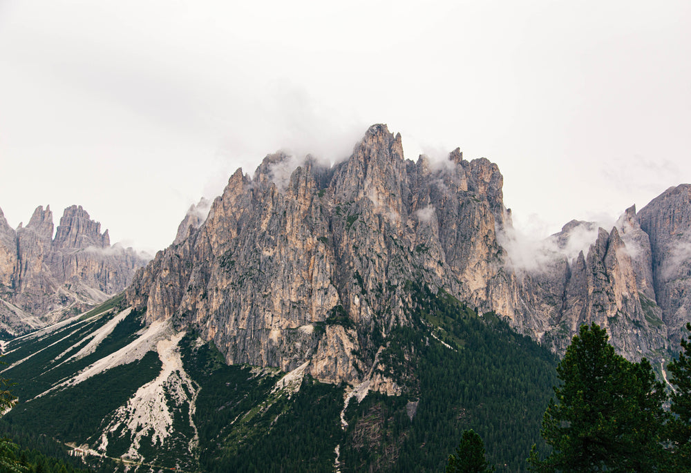 mountain peaks engulfed in low clouds